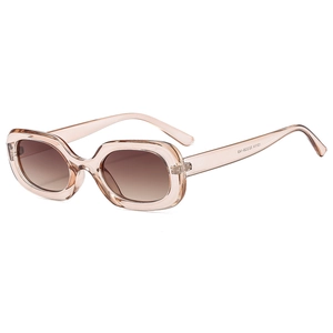 Vintage oval champagne pink sunglasses with brown gradient lenses for a stylish retro look