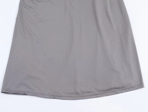 Detail of grey knitted dress hem showing high density fabric and fine twin needle stitching
