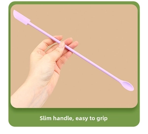 Detailed macro view of purple silicone makeup spatula with slender handle and dual-end tip