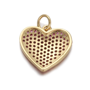 Detail of golden heart-shaped zircon pendant with honeycomb texture and top ring