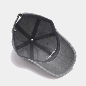 Detailed interior of washed cotton baseball cap with sweatband and metal buckle adjustment
