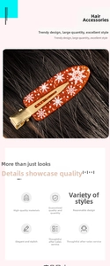 Detailed view of orange translucent hair claw with snowflake patterns on dark hair