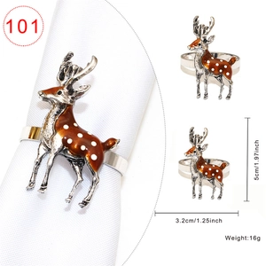 Vintage silver metal reindeer napkin ring with brown enamel detail and white spots