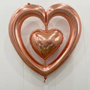 Detailed view of interconnected rose gold heart balloons with dimensions 98 x 102 cm