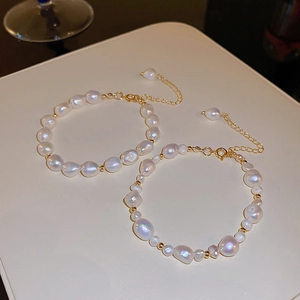 Detail of baroque freshwater pearl bracelets with gold beads and adjustable lobster clasp