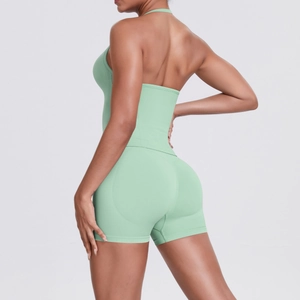 Detail view of mint green halter backless top and high waist yoga shorts set