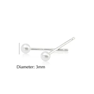 Close-up of 3mm minimalist silver ball stud earrings showing diameter measurement