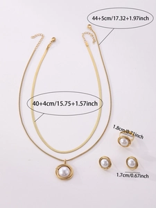 Detail view of gold jewelry set dimensions including necklace, ring and pearl earrings