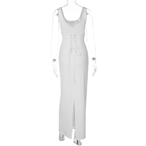 Detailed back view of white maxi dress featuring lace-up corset waist and rear slit
