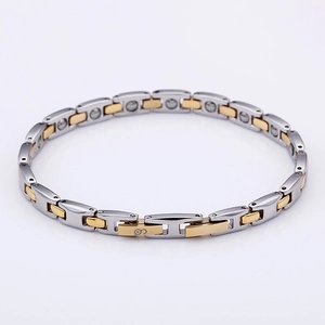 Detail view of two-tone stainless steel magnetic bracelet with gold and silver links