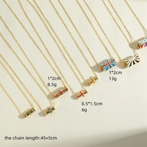 Gold cylinder evil eye pendants with textured patterns and adjustable chain necklace