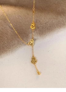 Macro shot of 18k gold plated triple gourd pendants with matte textured finish detail