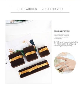 Flat lay of brown velvet jewelry gift boxes with gold silk bows and four size variants