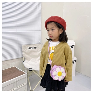 Toddler style featuring purple flower crossbody bag with mustard yellow cardigan