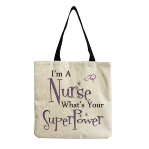 Close-up of nurse canvas tote bag with stethoscope print and quote on beige fabric