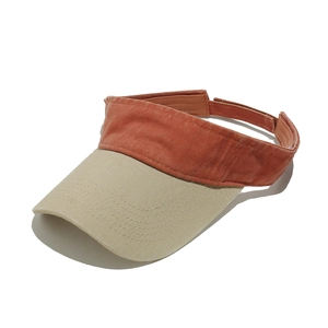 Close-up of vintage washed cotton sun visor with contrast stitching and retro texture
