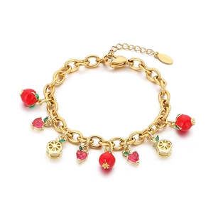 Gold chain bracelet featuring fruit charms with red enamel berries and pink zircon heart