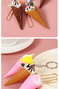 Miniature ice cream cone keychains in various colors displayed in a white porcelain dish