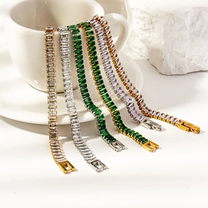 Close-up of multicolor zircon tennis bracelet with gold and silver link details