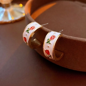Vintage C-shaped white enamel hoop earrings with red rose pattern and golden edges