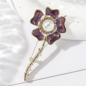 Elegant purple enamel daisy flower brooch with pearl center and golden metal finish