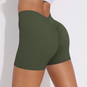 Detail of high-waisted olive green yoga shorts with scrunch butt lifting design
