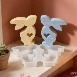 Dual rabbit silicone mold for DIY candles featuring heart-shaped cutouts and matte finish