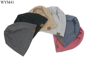 Detail of multi-color cotton beanies with small brown F&S leather patch on side