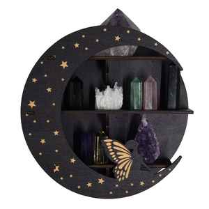 Three-tier black moon shelf with golden stars holding various natural crystal stones