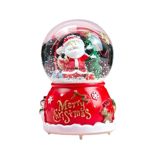 Christmas musical crystal ball with Santa Claus, reindeer base and artificial snow