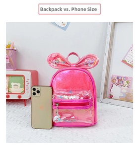 Pink mini sequin backpack for girls featuring a large bow and phone size comparison