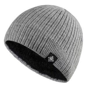 Detailed close-up of double-layer knit beanie with thick fleece lining and snowflake tag