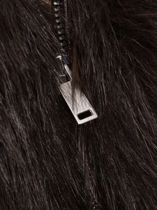Close-up of dark brown faux fur texture with high-quality silver metal zipper detail
