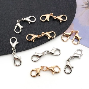 Close-up of gold and silver zinc alloy double-headed lobster clasps for DIY jewelry making