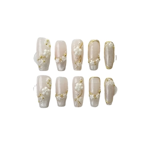 Handmade press-on nails with pink cat-eye gradient, 3D floral accents and pearls
