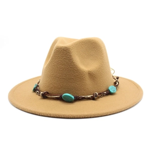 Close-up of khaki wool fedora featuring turquoise bead embellishments on decorative band