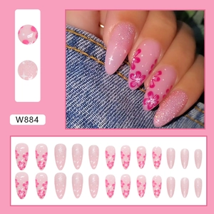Stunning pink almond press-on nails featuring delicate cherry blossom floral and glitter