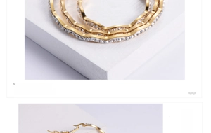 Macro detail of wave-shaped gold hoop earrings with micro-pave white rhinestones