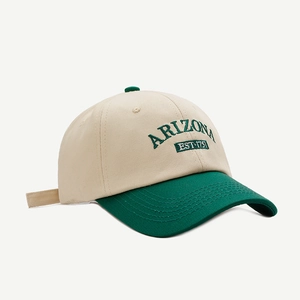 Detail view of Arizona EST 1751 embroidery on two-tone beige and green cotton baseball cap