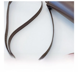 Detail shot of the comfortable dark brown leather shoulder strap with neat stitching
