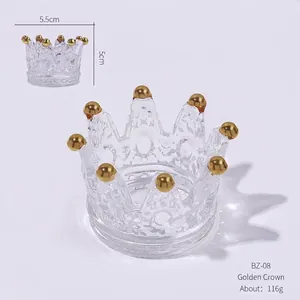 Detailed view of crown shaped glass container with gold tips and dimension markings
