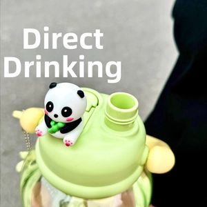 Close-up of cute panda figurine on green water bottle lid with direct drinking spout
