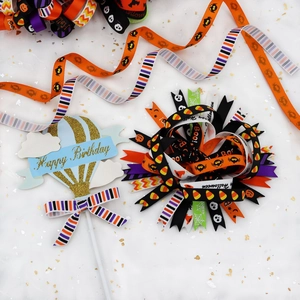 Detail of 10mm Halloween ribbons and gold Happy Birthday hot air balloon cake topper