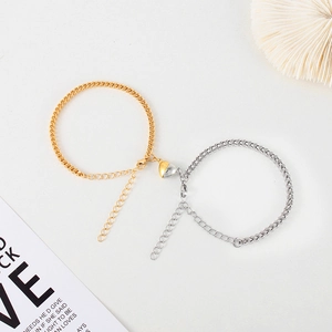 Matching stainless steel heart magnet bracelets for couples in gold and silver finish