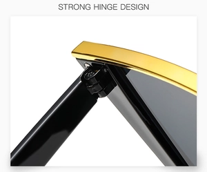 Detail of reinforced metal hinge and gold frame on black cat-eye sunglasses