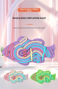 Detailed view of silicone sensory activity board in fish shape with colorful fidget strings