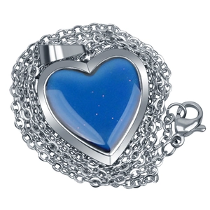 Detail of silver heart locket pendant with blue temperature color-changing stone