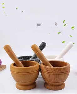 Close-up of wood-grain and stone-texture PP garlic mortars and pestles on white background