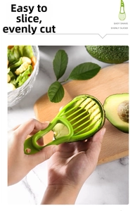 Close-up of avocado slicer cutting uniform segments on a wooden board