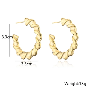 Detail view of 3.3cm gold-plated spiral hoop earrings with size and weight specs